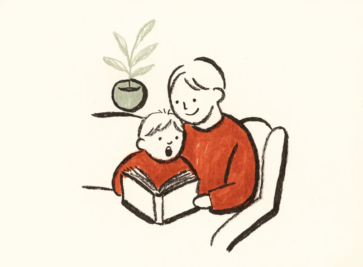 Illustration of a parent sitting in an armchair with a young child tucked beside them, both looking at an open book.